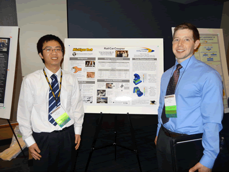 NURail undergraduate students from Michigan Tech present a poster on their railway coupler design project at the Joint Rail Conference.