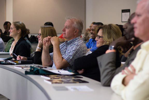 Adult students listening to lecture