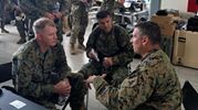 'Marine Col. Thomas Prentice, commanding officer of Special Purpose Marine Air-Ground Task Force Southern Command, speaks with Col. Ryan S. Rideout, commanding officer of the 24th Marine Expeditionary Unit about ongoing relief operations in Haiti. -Photo by Staff Sgt. Robert Durham'