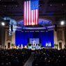 stage in auditorium with American flag
