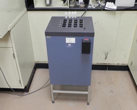 The image shows an isothermal calorimeter with sixteen channels and four glass ampoules.  Eight of the channels are used for the reference materials and the other eight are used for the materials under study.  Isothermal calorimeter is a versatile tool for monitoring the hydration of cementitious materials at the early age. 