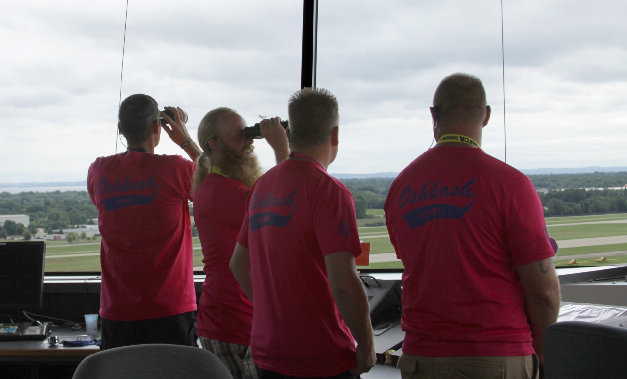 Picture of aviation enthusiasts in control tower