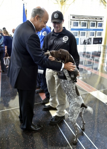 Secretary Johnson greets a transportation security canine