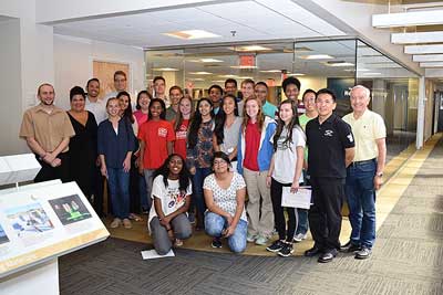 This image shows FHWA staff who hosted this event and all students who participate in and FHWA staff who hosted and participated in this eventit facing the camera for a group photo.