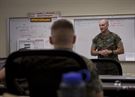 U.S. Marine Corps Sgt. Maj. Troy E. Black, sergeant major of 1st Marine Logistics Group (1st MLG), speaks to students attending the Ground Supply Officer Course, Ground Supply School (GSS), Marine Corps Combat Service Support Schools (MCCSSS), aboard Camp Johnson, N.C., Aug. 8, 2016. Brig. Gen. Ottignon and Sgt. Maj. Troy E. Black visited with the GSS students and staff at MCCSSS to receive information concerning current school initiatives, operations and advocacy. (U.S. Marine Corps photo by Cpl. Laura Mercado)