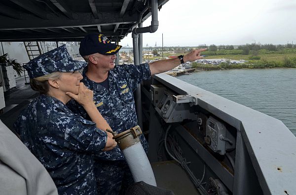 Commanding Officer of the submarine tender USS Frank Cable (AS 40), Capt. Mark Benjamin, right, shows different areas of Guam to Chief of Navy Reserve Vice Adm. Robin Braun, from the ship's bridge wing July 10, during a tour of the ship.  Braun visited Frank Cable to meet with Sailors and to observe the roles and functions Navy Reservists have onboard.  Frank Cable, forward deployed to the island of Guam, conducts maintenance in support of submarines and surface vessels deployed in the U.S. 7th Fleet area of responsibility.  

 U.S. Navy photo by Mass Communication Specialist 2nd Class Brian T. Glunt (Released)  150710-N-RN782-038