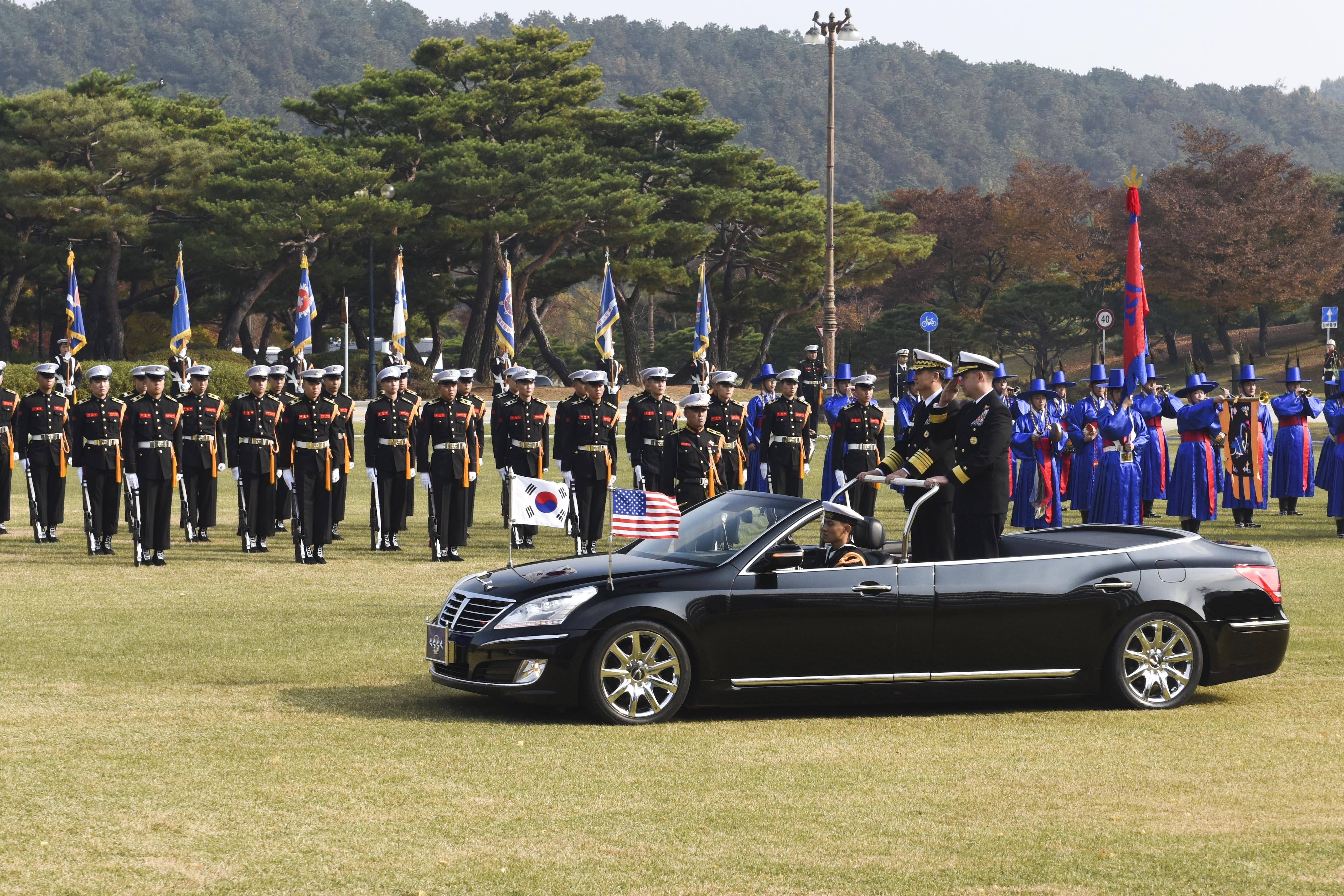 161103-N-WT427-113 GYERYONGDAE, Republic of Korea (Nov. 3, 2016) Rear Adm. Brad Cooper, commander, U.S. Naval Forces Korea (CNFK) joined Republic of Korea (ROK) Chief of Naval Operations Adm. Um, Hyun sung, for  a pass and review of ROK sailors and honour parade during Cooper's visit. CNFK is the U.S. Navy's representative in the ROK, providing leadership and expertise in naval matters to improve institutional and operational effectiveness between the two navies and to strengthen collective security efforts in Korea and the region. (U.S. Navy photo by Petty Officer 2nd Class Jermaine M. Ralliford)