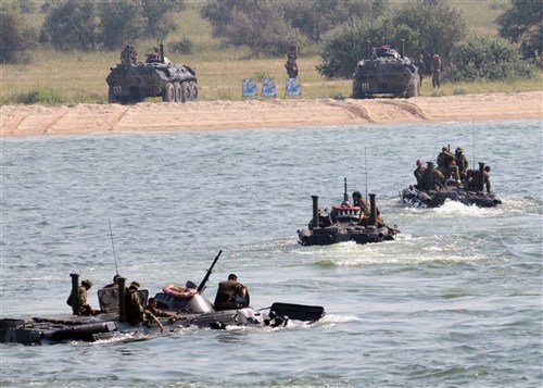 TENDRA, Ukraine &mdash; Ukrainian marine 1st and 2nd divisions, from Shiroky Lan Air Field, stormed the beaches of Tenrda island from amphibious assault ships and helicopters to simulate landing on an island over run by pirates during exercise Sea Breeze 2010 July 15. Sea Breeze is an invitational combined and joint maritime exercise in the Black Sea with the goals of enhancing Black Sea nation maritime security capabilities and improving Black Sea theater security cooperation strategies. Sea Breeze is the largest exercise this year in the Black Sea including 20 ships, 13 aircraft and more than 1,600 military members from Azerbaijan, Austria, Belgium, Denmark, Georgia, Germany, Greece, Moldova, Sweden, Turkey, Ukraine and United States. (U.S. Navy photo by Mass Communication Specialist 3rd Class Kristopher Regan)