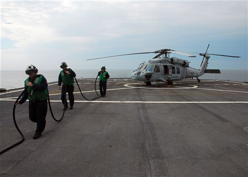 USS MOUNT WHITNEY, Baltic Sea &mdash; Sailors attached to Helicopter Sea Combat Squadron (HSC) 28 detachment one remove a fuel line from an MH-60 Sea Hawk helicopter aboard amphibious command ship USS Mount Whitney (LCC/JCC 20) June 7. Mount Whitney is the flagship for Commander, U.S. 6th Fleet and is in the Baltic Sea supporting Baltic Operations (BALTOPS) 2010, a combined land and sea exercise intended to improve interoperability with partner nations by conducting realistic training with the 12 participating nations. (U.S. Navy photo by Mass Communication Specialist 1st Class (SW/AW) Jenniffer Rivera)