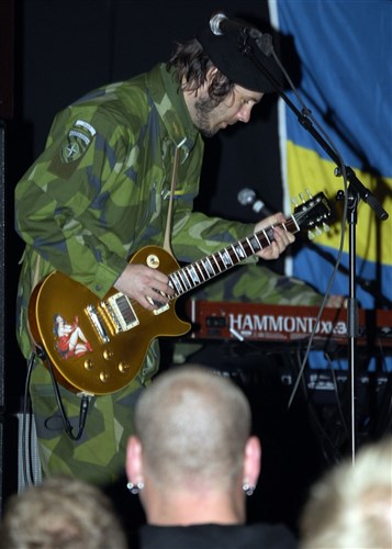 KARLSKRONA, Sweden &mdash; A Swedish guitarist plays classic rock here June 6 for sailors from 12 nations during a harbor party before the initial phase of Baltic Operations (BALTOPS) exercise 2009. This is the 37th iteration of BALTOPS and is intended to improve interoperability with partner countries by conducting realistic training at sea with the 12 participating nations. (Department of Defense photo by Navy Mass Communication Specialist 3rd Class Christian T. Martinez)