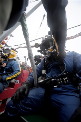 NORTH SEA (July 26, 2011) - Navy Divers assigned to Mobile Diving and Salvage Unit (MDSU) 2 standby to move to the dive stage for dive operations from the Military Sealift Command rescue and salvage ship USNS Grasp (T-ARS 51). MDSU-2 and Navy archeologists, scientists, and historians are in the North Sea conducting diving operations verifying the
sites of suspected shipwrecks. The researchers hope to find USS Bonhomme Richard, the historic ship commanded by John Paul Jones. (U.S. Navy Photo by Mass Communication Specialist 1st Class Ja&#39;lon A. Rhinehart/RELEASED)