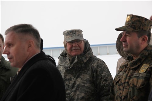 U.S. Army Brig. Gen. Gary Huffman, commander, NATO Headquarters in Sarajevo and Bosnia and Herzegovina Air Force Deputy Chief of Joint Staff Major-General  Rizvo Pleh stand in attendance after the delivery of equipment, Feb. 12. The delivery was part of a military-to-military exchange between BiH and U.S. Forces in efforts to help citizens with severe weather, heavy snow and intense cold that have stricken the country over the last week. 