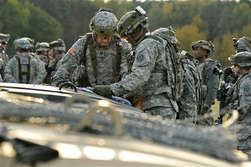 U.S. Army Europe Soldiers, assigned to 2nd Cavalry Regiment, study a map and prepare to convoy though the Maneuver Rights Area near Amberg, Germany,  enroute to the Joint Multinational Readiness Center’s Hohenfels Training Area, Oct. 16. The U.S. Army Europe's exercise Saber Junction 2012 trains U.S. personnel and 1800 multinational partners from 18 nations ensuring interoperability and an agile, ready coalition force. 