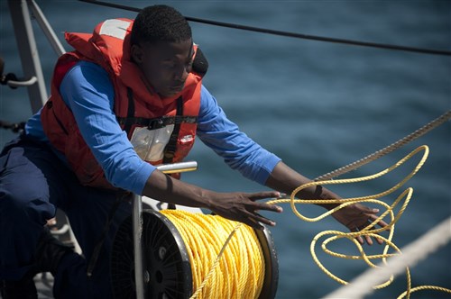 BLACK SEA - Boatswain's Mate 3rd Class Julius McGowan pays out tending line during a man overboard drill aboard the guided-missile destroyer USS Jason Dunham (DDG 109) during Exercise Sea Breeze 2012 (SB12). SB12, co-hosted by the Ukrainian and U.S. navies, aims to improve maritime safety, security and stability engagements in the Black Sea by enhancing the capabilities of Partnership for Peace and Black Sea regional maritime security forces. 