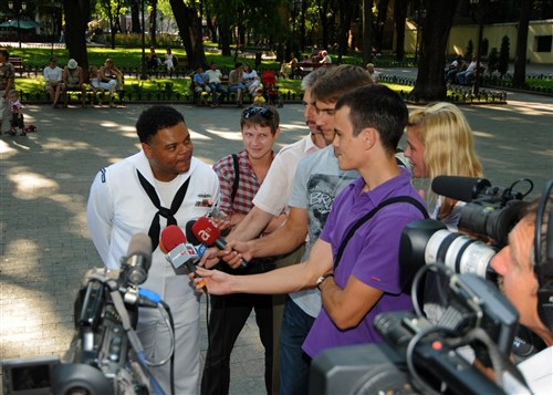 ODESSA, Ukraine &mdash; Musician Petty Officer 2nd Class Kori Gillis, lead vocalist for Commander, U.S. Naval Forces Europe rock band  â?Flag Shippâ?, speaks with local and international media before performing a free concert for the local community at Gorsad Garden, during exercises Sea Breeze 2010 July 22. Sea Breeze is the largest exercise this year in the Black Sea including 25 ships, 13 aircraft and more than 1,600 military members from Azerbaijan, Austria, Belgium, Denmark, Georgia, Germany, Greece, Moldova, Sweden, Turkey, Ukraine and United States.  (U.S. Navy photo by Mass Communication Specialist 1st Class (SW) Gary Keen)