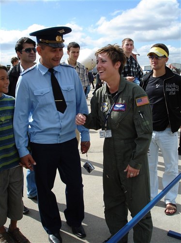 ZHUKOVSKY, Russia -- Air Force Staff Sgt. Christy Jeffreys, KC-10 Extender boom operator with the 79th Air Refueling Squadron, Travis Air Force Base, Calif., talks with visitors at the Moscow International Air Show and Space Salon here Aug. 18. 