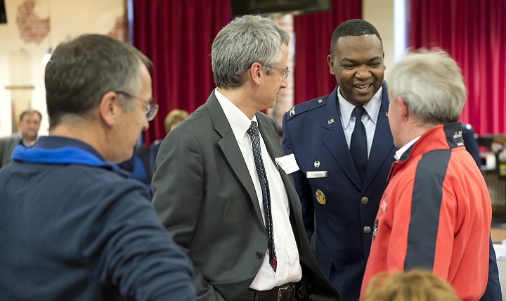 Air Force Col. Alfred K. Flowers, Jr., 52nd Medical Group commander, Spangdahlem Air Base, Germany, greets a group of German doctors on base at the Brick House. Spangdahlem Airmen and their families rely on local doctors for specialty healthcare. The event brought more than 20 German doctors to the base, which allowed them and base medical care providers to discuss respective healthcare capabilities, practices, philosophies, approaches and concerns in an effort to continuously provide trusted care to Spangdahlem families. (U.S. Air Force photo by Tech. Sgt. Amanda Currier)