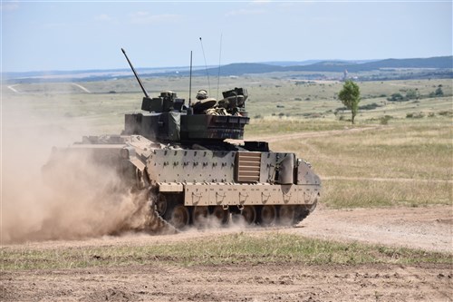 A M2A3 Bradley Fighting Vehicle from 5th Squadron, 7th Calvary Regiment conducts maneuvers as part of a section gunnery qualification at Camp Ujmajor, Hungary July 21. The squadron continues to progress through their gunnery qualification tables as they build up to a Combined Arms Live Fire Exercise in August.