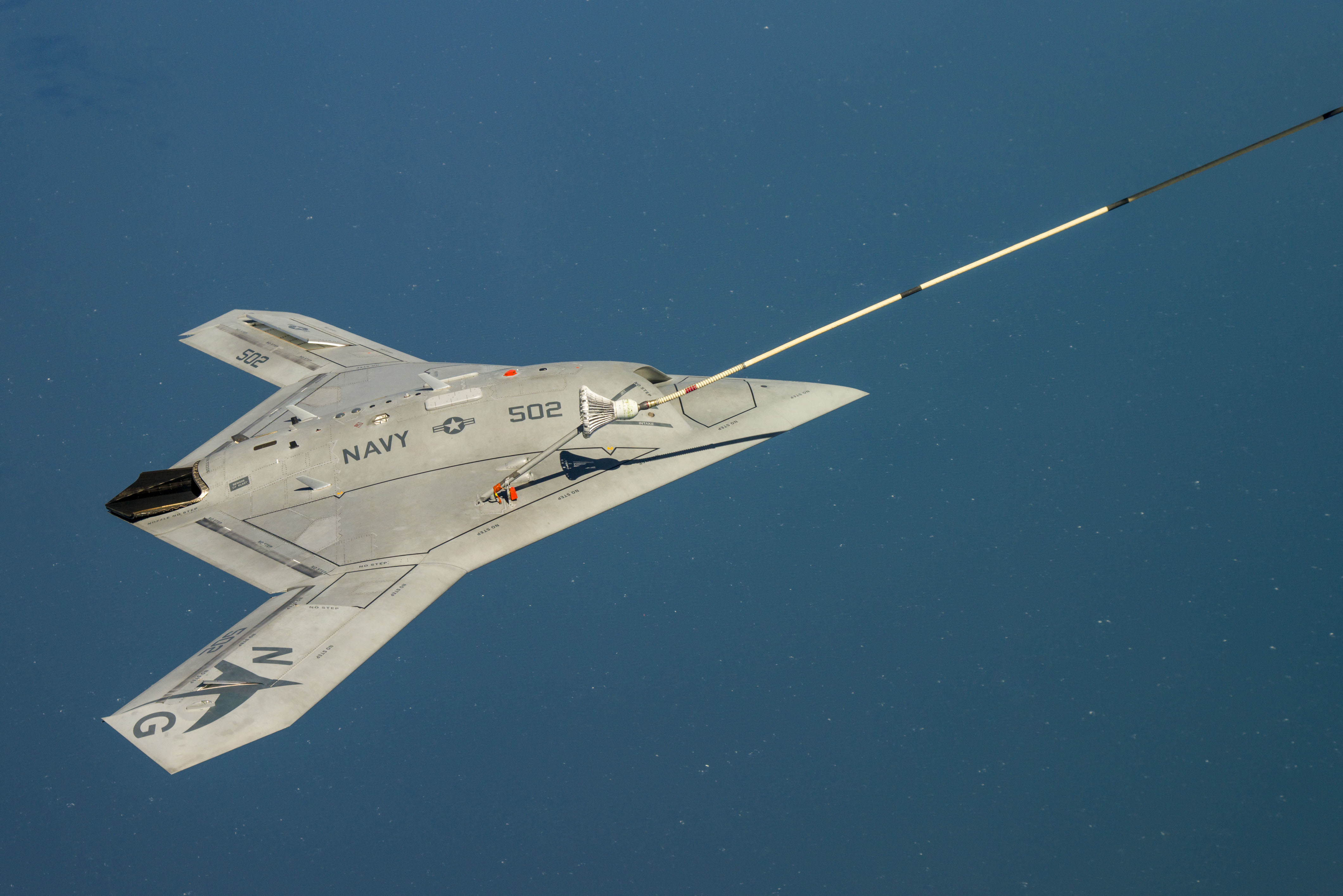 PATUXENT RIVER, Md. (April 22, 2015) The Navy's unmanned X-47B receives fuel from an Omega K-707 tanker while operating in the Atlantic Test Ranges over the Chesapeake Bay. This test marked the first time an unmanned aircraft refueled in flight. (U.S. Navy photo/Released)