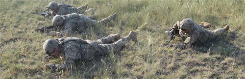 Troopers from 5th Squadron, 7th Calvary Regiment, 1st Armored Brigade Combat Team, 3rd Infantry Division do 3-5 second buddy rushes during a stress shoot at Camp Ujamajor, Hungary July 13, 2016. The Troopers are in Hungary as a part of Operation Atlantic Resolve, a demonstration of continued U.S. commitment to the collective defense of Europe through a series of actions designed to reassure NATO allies and partners of our dedication to enduring peace and stability in the region.