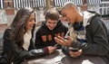 Kids talking at a table outside