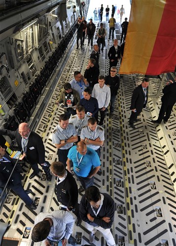BERLIN - Aircraft industry representatives wait in line to see the flight deck of a C-17 Globemaster during the Berlin Air Show, commonly known as ILA 2012, Sept. 13, 2012. The air show is an international event hosted by Germany and more than 50 U.S. military personnel from bases in Europe and the United States are here to support the various U.S. military aircraft and equipment on display. Other U.S. military aircraft featured at ILA 2012 are the UH-60 Black Hawk, UH-72A Lakota, F-16C Fighting Falcon and C-130 Hercules.