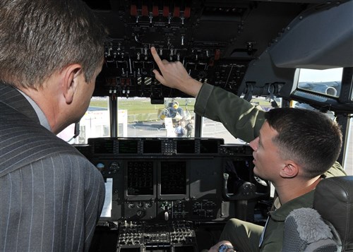 BERLIN - Capt. Kevin McCutcheon 37th Air Lift Squadron pilot, Ramstein Air Base, Germany, explains the equipment in the flight deck of a C-130 Hercules during the Berlin Air Show, commonly known as ILA 2012, here Sept. 13, 2012. The air show is an international event hosted by Germany and more than 50 U.S. military personnel from bases in Europe and the U.S. are here to support the various U.S. military aircraft and equipment on display. Other U.S. military aircraft featured at ILA 2012 are the UH-60 Black Hawk, UH-72A Lakota, F-16C Fighting Falcon and C-17 Globemaster III.