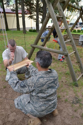 Pabraddd, Lithuania -- Members from the Pennsylvania National Guard visited the Pabrades Vaiku Globas Numai orphanage June 20. During the visit Guard members repaired sports and playground equipment, assisted with landscaping chores and visited and played with the children at the facility. Nearly 50 troops from the Pennsylvania National Guard are in Lithuania supporting Amber Hope 2011, a NATO exercise with more than 2,000 participants from nine countries.