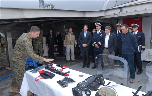SPLIT, Croatia (Apr. 4, 2012) - 1st Lt. Jared Batzel (left), instructor from the U.S. Marine Corps Black Sea Rotational Force, gives a non-lethal weapons brief to (from right-front) Dr. Dragan Lozancic, Croatian assistant minister of defense, Alaskan Senator Mike Begich, Croatian Rear Adm. Ante Urlich, chief of naval operations, and U.S. Ambassador James Foley on board the High-Speed Vessel (HSV 2) Swift. Swift is a U.S. Military Sealift Command-chartered high-speed vessel currently deployed to the U.S. 6th Fleet's Area of Responsibility in support of theater security cooperation efforts.
