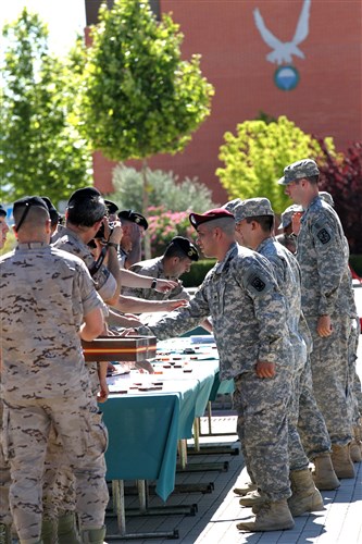 Cadets received their foreign jump wings on the parade field at BRIPAK -- La Brigada Paracaidist. It is located near Madrid, and the English classes the Cadets helped teach were located on the base. Foreign jump wings are a prized possession in the U.S. Army airborne community. For an Army ROTC Cadet to earn foreign jump wings before he or she is even commissioned is rare.