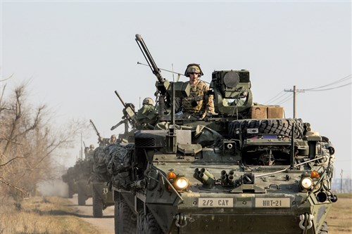 U.S. soldiers in Stryker armored vehicles arrive at Smardan Training Area, Romania, March 24, 2015. The soldiers, assigned to 2nd Squadron, 2nd Cavalry Regiment, participated in Saber Junction 15, which included 5,000 troops from 17 nations that are NATO allies and partners. (U.S. Army photo by Staff Sgt. Opal Vaughn/Released)