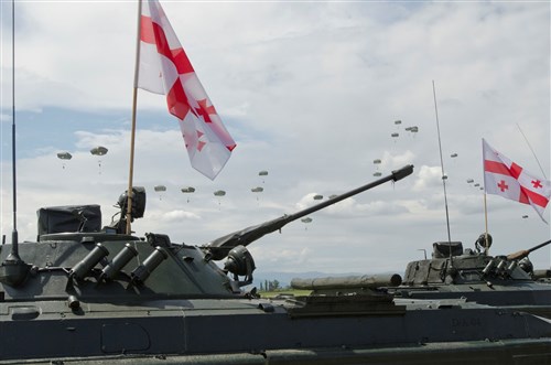 Paratroopers from the 173rd Airborne Brigade parachute into the opening ceremony of Exercise Noble Partner here May 10, 2015. Noble Partner is a U.S. Army Europe-Georgia exercise in support of Georgia's contribution to the NATO Response Force.