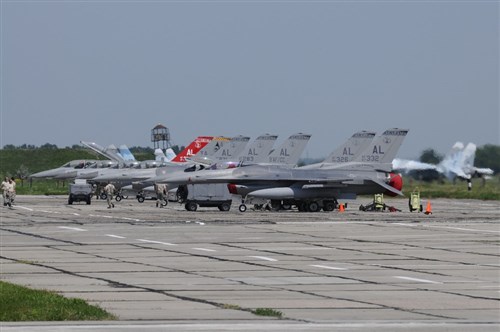 Lined-up and ready to go, seven Air National Guard F-16C/Ds sit on the ramp at Mirgorod Air Base Ukraine.  .  The Air National Guard is in Ukraine supporting SAFE SKIES 2011, a 2-week multinational flying event preparing Ukraine and Poland to better protect their airspace during the 2012 EUROPCUP.   (U.S. Air Force Photo by Tech. Sgt. Charles Vaughn, 144 FW/PA / Released)