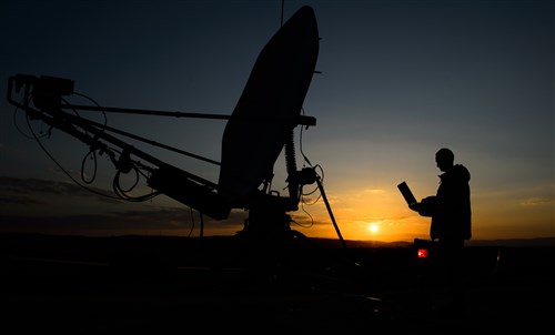 Senior Airman David Vogt, 1st Combat Communications Squadron radio frequency transmission technician, ensures proper connection for the 435th Air Ground Operations Wing at Campia Turzii, Romania, March 16, 2015. The 435th Air Ground Operations Wing participated in Dacian Warhawk, which featured U.S. and Romanian Airmen working side-by-side to establish a base and conduct both ground and air operations with NATO partners. (U.S. Air Force photo/Staff Sgt. Armando A. Schwier-Morales)