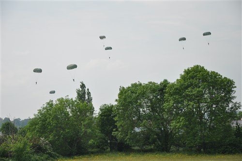 ANGOVILLE AU PLAIN, France – U.S. and British troops took part in a ceremony at Angoville au Plain – where Soldiers from the 101st Airborne Infantry Division fought during the D-Day operations. In 2006, a stained glass window was dedicated to the Screaming Eagles in the church, which had served as a medical aid station for German and U.S. forces during the fighting. 