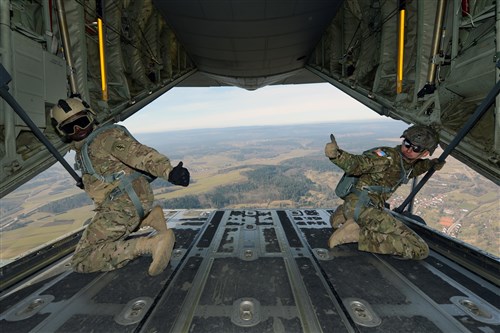 U.S. Soldiers assigned to 1st Battalion, 10th Special Forces Group (Airborne) check conditions before their fellow Soldiers jump out of the C-130 Hercules aircraft over a drop zone in Germany March 17, 2015. (U.S. Army photo by Visual Information Specialist Jason Johnston/Released)