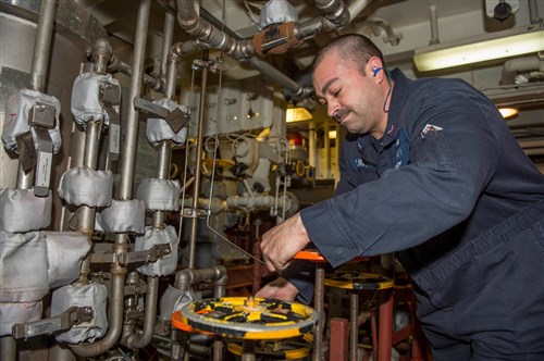 Damage Controlman 1st Class Brian Quintana from Silver City, N.M., aligns the lube oil filter/separation purifier in a main engine space aboard USS Laboon (DDG 58) March 24, 2015. Laboon, an Arleigh Burke-class guided-missile destroyer, homeported in Norfolk, is conducting naval operations in the U.S. 6th Fleet area of operations in support of U.S. national security interests in Europe. (U.S. Navy photo by Mass Communication Specialist 3rd Class Desmond Parks)