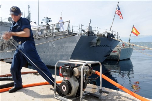 SOUDA BAY, Crete (June 3, 2011) - U.S. Navy Fireman Ryan Sypnieski, starts a P-100 water pump during a damage control exercise at Marathi Pier in Souda Bay as a part of Phoenix Express 2011 (PE-11). PE-11 is a three-week exercise divided into in-port and underway training phases and is designed to enhance regional maritime partnerships among the 14 participating countries in their efforts to deter illicit trafficking at sea. (U.S. Navy photo by Mass Communication Specialist 1st Class Edward Vasquez/RELEASED) 