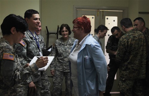 U.S. Army soldiers from the 196th Medical Support Unit, along with soldiers from Bosnia and Herzegovina, annotate their observances and speak with staff members while visiting Dom Zdravlja Hospital in Capljina, Bosnia and Herzegovina May 29, 2012. Service members from Bosnia and Herzegovina, the U.S., and several other countries are taking part in Shared Resilience 2012, a two-week U.S. Joint Chiefs of Staff sponsored medical exercise.