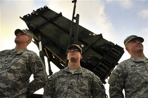 U.S. Soldiers stand by a Patriot missile battery at a Turkish army base in Gaziantep, Turkey, Feb. 4, 2013, while awaiting the arrival of U.S. Deputy Secretary of Defense Ashton B. Carter. Carter visited the area to view Patriot missile batteries installed with assistance from U.S. troops. U.S. and NATO Patriot missile batteries and personnel deployed to Turkey in support of NATO's commitment to defending Turkey?s security during a period of regional instability. 