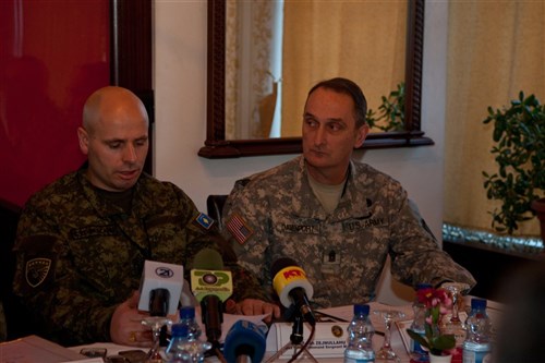 U.S. Army Europe Command Sgt. Maj. Davis S. Davenport sits next to the Command Sgt. Major of the Kosovo Security Forces, Fetah Zejhullahu during the Regional Senior Noncommissioned Officer Conference for the Land Forces Senior NCO and Senior Enlisted Leader at the Hotel Adria in Pristina, Kosovo, Monday, Jan. 14. Davenport said this conference, a first for Kosovo, was designed to help develop NCOs, network and develop relationships to help each other better train, develop and prepare soldiers for combat roles. 