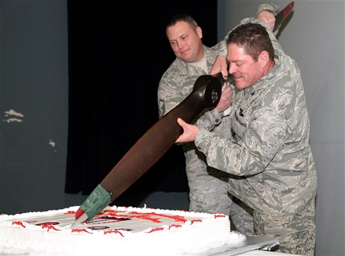 The senior U.S. Air Force service members in U.S. Special Operations Command Europe, Col. Ben McMullen and Master Sgt. Jeffery Jordan, ceremonialy cut the cake using an old airplane prop during the 59th SOCEUR Establishment Day ceremony. Establishment Day is an annual event hosted by SOCEUR to celebrate its inception and history since forming Jan. 22, 1955.

