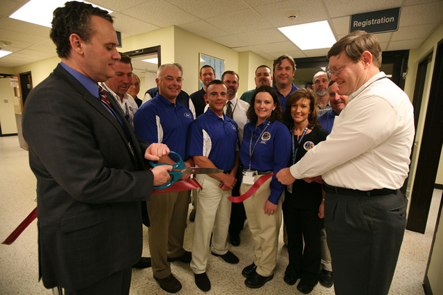 Anniston, Ala., Feb. 1, 2012 -- FEMA Chief of Staff Jason McNamara (Left) and Center for Domestic Preparedness Superintendent Dr. Christopher T. Jones cut the ribbon opening the renovated emergency department inside the Noble Training Facility (NTF).