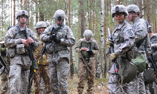 GRAFENWOEHR, Germany - Italian and American soldiers get ready to go through a combat testing lane to prepare for the 2012 U.S. Army Europe Expert Field Medical Badge assessment in Grafenwoehr, Germany, Sep. 12