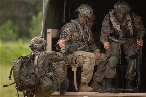 U.S. Soldiers of Headquarters and Headquarters Company, 1st Battalion, 504th Parachute Infantry Regiment prepare for movement during Swift Response 16 training exercise at the Hohenfels Training Area, a part of the Joint Multinational Readiness Center, in Hohenfels, Germany, Jun. 22, 2016. Exercise Swift Response is one of the premier military crisis response training events for multi-national airborne forces in the world. Swift Response 16 includes more than 5,000 Soldiers and Airmen from Belgium, France, Germany, Great Britain, Italy, the Netherlands, Poland, Portugal, Spain and the United States and takes place in Poland and Germany, May 27-June 26, 2016. (U.S. Army photo by Spc. Bryan Rankin/Released)