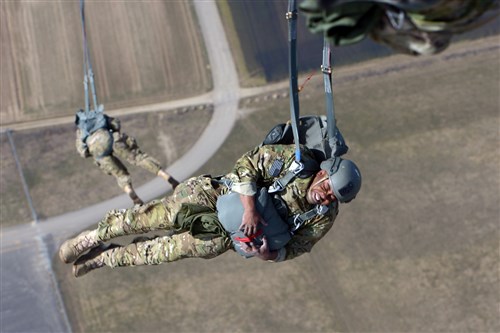 A U.S. Soldier assigned to 1st Battalion, 10th Special Forces Group (Airborne) free falls as his parachute opens after jumping out of a C-130 Hercules aircraft over a drop zone in Germany, March 17, 2015. (U.S. Army photo by Visual Information Specialist Jason Johnston/Released)