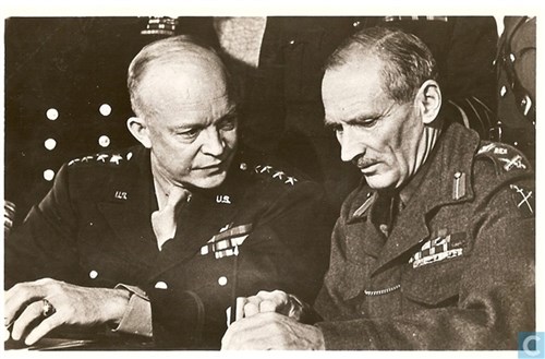 Gen Eisenhower and Gen Montgomery confer during a meeting.