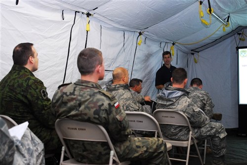 Lithuanian, Polish and U.S. air planners take part in a part in a training seminar to better synchronize and coordinate air planning with each other during the Jackal Stone 10 exercise held in Swidwin, Poland. Jackal Stone is an annual international special operations forces (SOF) exercise held in Europe. Its objective is to enhance capabilities and interoperability amongst the participating special operations forces as well as build mutual respect while sharing doctrinal concepts. The exercise, which is coordinated by U.S. Special Operations Command Europe, includes Poland, Lithuania, Latvia, Croatia, Romania, and Ukraine. (U.S. Army photo by Sgt. Eric J. Glassey)
