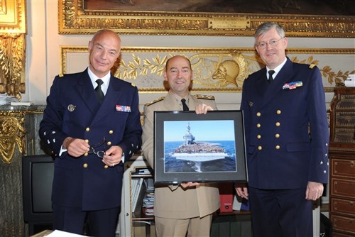 PARIS, France &mdash; French navy Vice Adm. Richard Laborde, the director of the Institute of Higher National Defense Studies and of Higher Military Training,left, and the French Chief of Defense, French navy Adm. Edouard Guillaud,right, present Supreme Allied Commander Europe U.S. Navy Adm. James Stavridis with a framed picture of the French aircraft carrier Charles de Gaulle May 7. They are standing in the Salon Des MarrÃchaux, a room inside the  Ãcole Militaire, which was used by Emperor Napoleon as an office and is now used by Laborde. (Department of Defense photo)