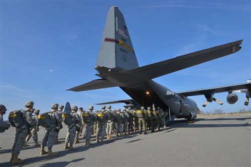 U.S. Army paratroopers, assigned to 4th Battalion, 319th Airborne Field Artillery Regiment, 173rd Airborne Brigade, and Moldovan Special Forces Battalion soldiers board a Minnesota Air National  Guard C-130 Hercules as part of o multinational airborne training at the 7th Army Joint Multinational Training Command's Grafenwoehr Training Area, Germany, April 10, 2015. The 173rd Airborne Brigade is the Army contingency response force in Europe, capable of projecting ready forces anywhere in the U.S. European, Africa or Central commands areas of responsibility within 18 hours. (U.S. Army Photo by Visual Information Specialist Markus Rauchenberger/released)
